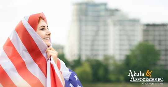 Woman wrapped in american flag