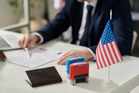 immigration officer sitting at a desk