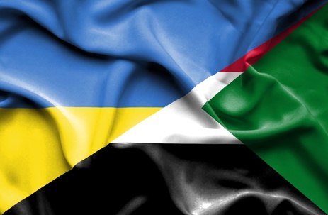 Waving flag of Sudan and Ukraine